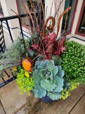 Large self-watering planter planted for fall at Pewaukee, WI business