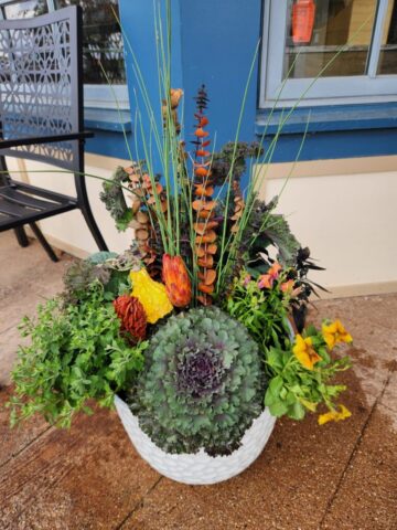 Pewaukee, WI bakery entrance with custom fall seasonal planter