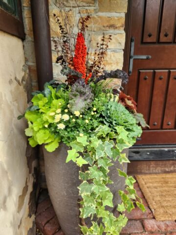 Front steps of home in Pewaukee WI custom designed planter planted for fall
